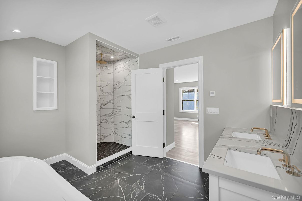 Bathroom, Dual Sink Vanities, Interior, Marble, Marble Walls, Recessed Lighting