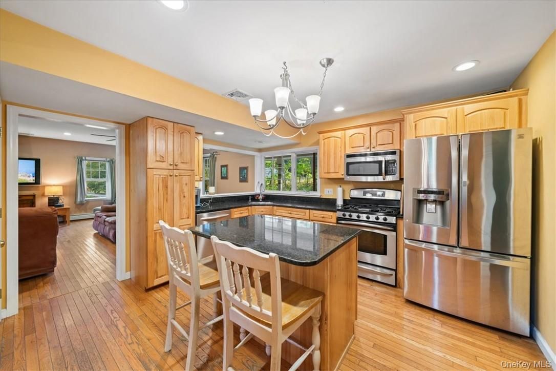 Chandelier, Interior, Kitchen, Living room, Recessed Lighting, Stainless Steel Appliances, Wood Texture Flooring