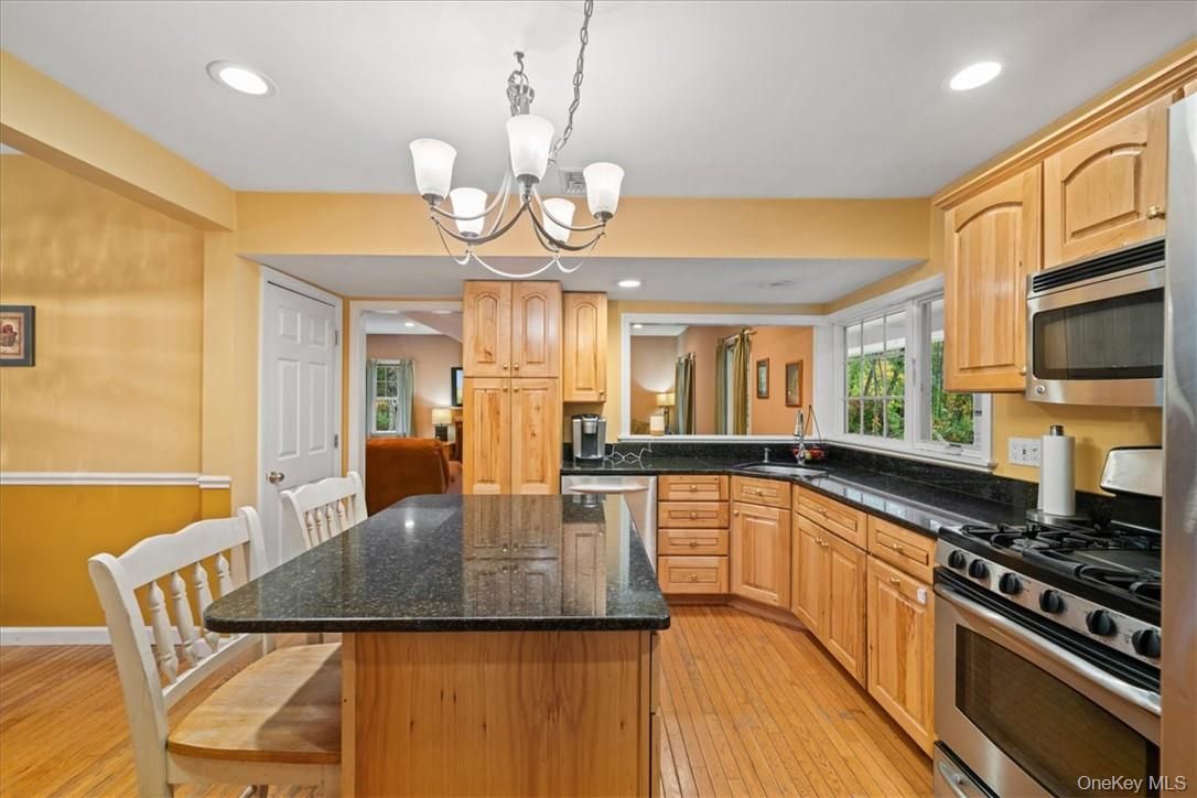 Chandelier, Dining room, Interior, Kitchen, Recessed Lighting, Stainless Steel Appliances, Wood Texture Flooring