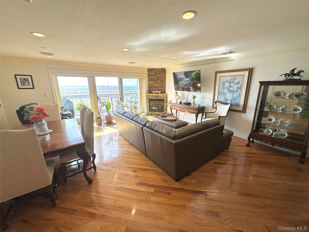 Dining room, Fireplace, Interior, Living room, Recessed Lighting, Wood Texture Flooring