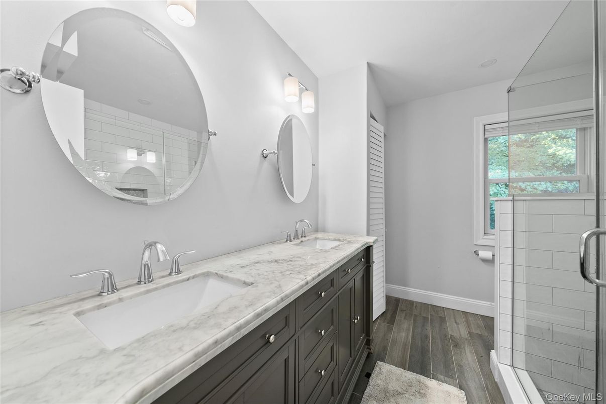 Bathroom, Dual Sink Vanities, Glass Shower, Interior, Wood Texture Flooring