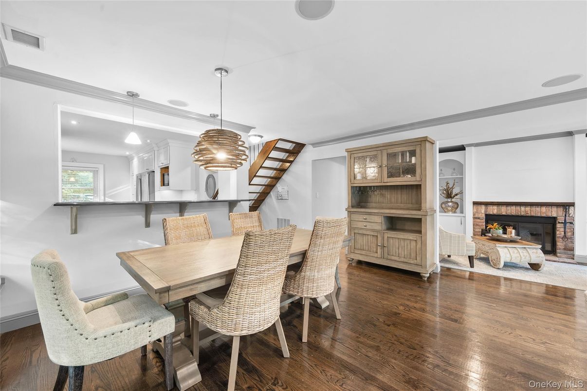 Dining room, Fireplace, Interior, Pendant Lights, Recessed Lighting, Wood Texture Flooring
