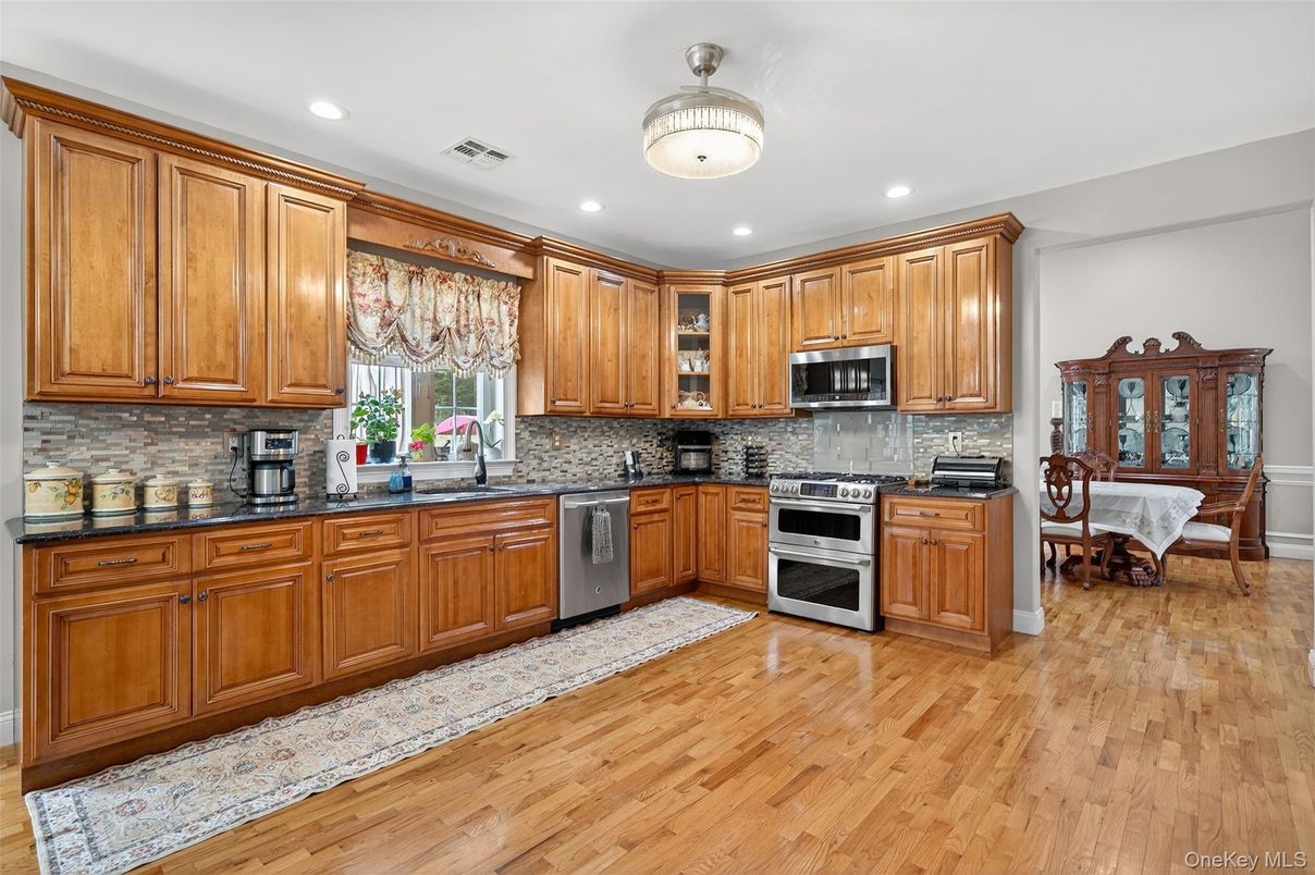 Dining room, Interior, Kitchen, Recessed Lighting, Stainless Steel Appliances, Wood Texture Flooring