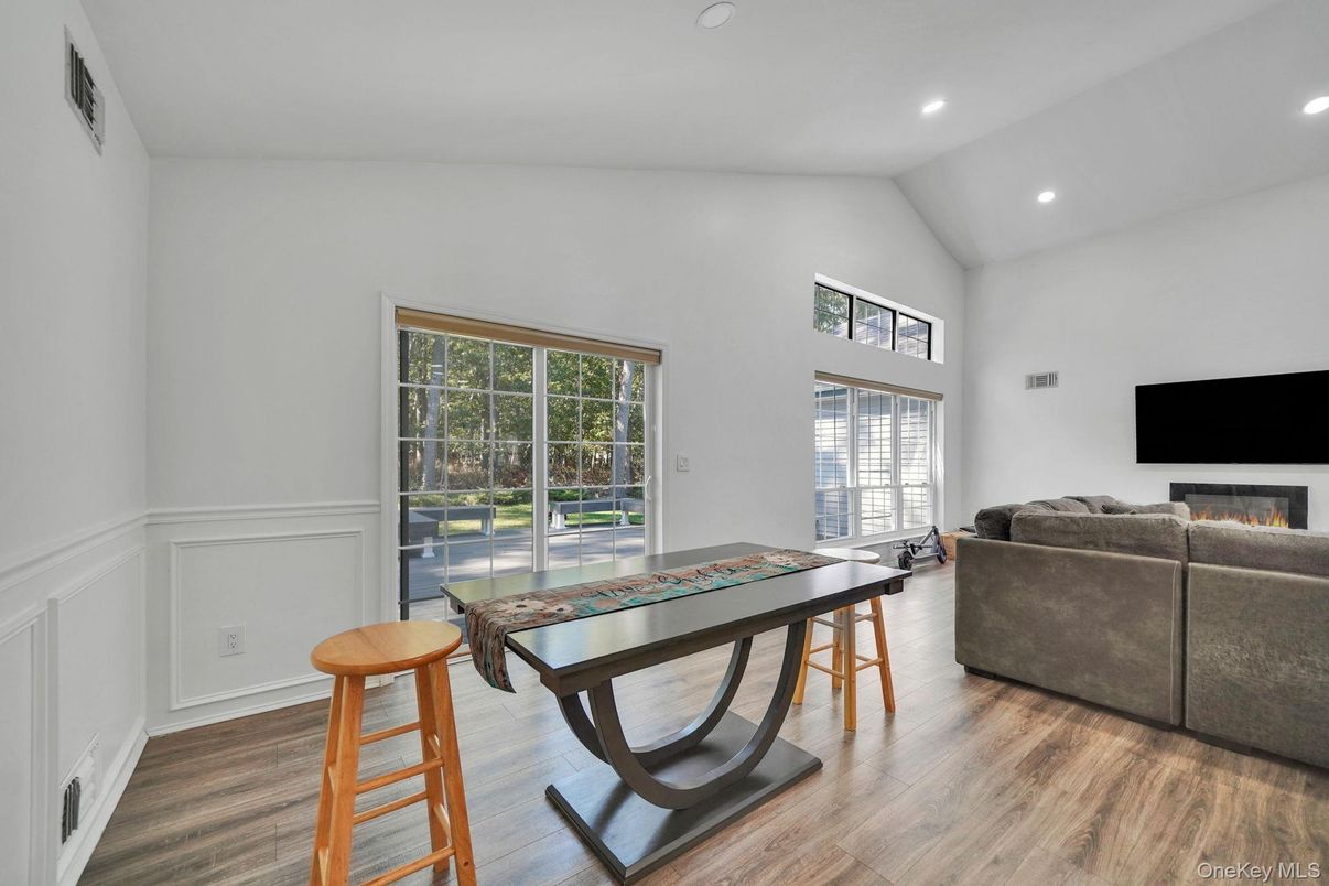 Fireplace, Game Room, Interior, Living room, Recessed Lighting, Wood Texture Flooring