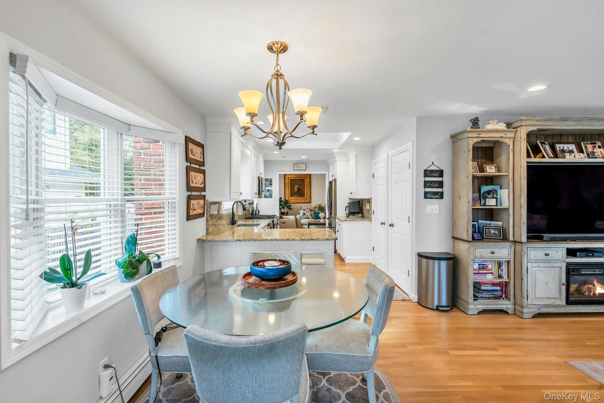 Chandelier, Dining room, Fireplace, Interior, Recessed Lighting, Wood Texture Flooring
