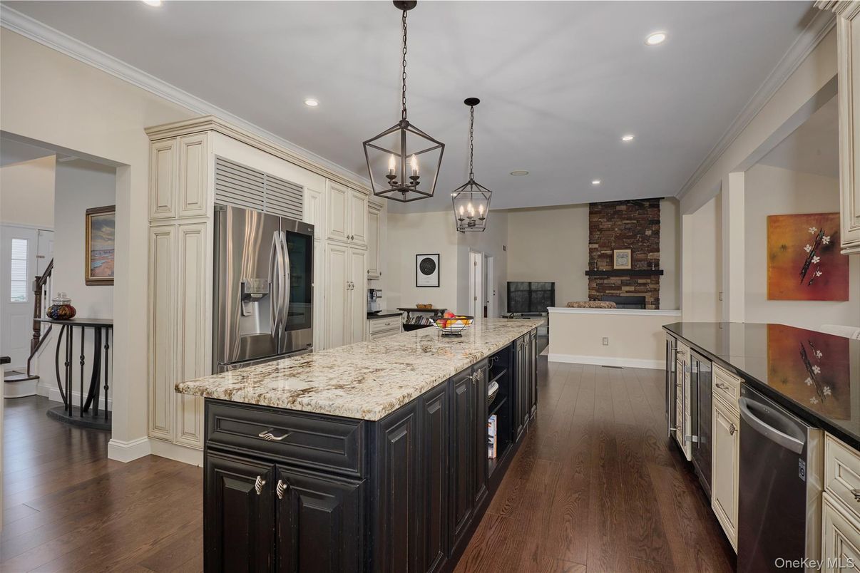 Fireplace, Interior, Kitchen, Pendant Lights, Recessed Lighting, Stainless Steel Appliances, Stone Walls, Wood Texture Flooring