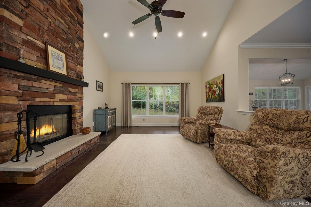 Fireplace, Interior, Living room, Pendant Lights, Recessed Lighting, Stone Walls, Wood Texture Flooring