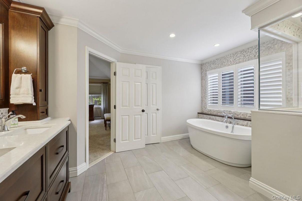 Bathroom, Dual Sink Vanities, Free Standing Baths, Interior, Recessed Lighting, Wood Texture Flooring