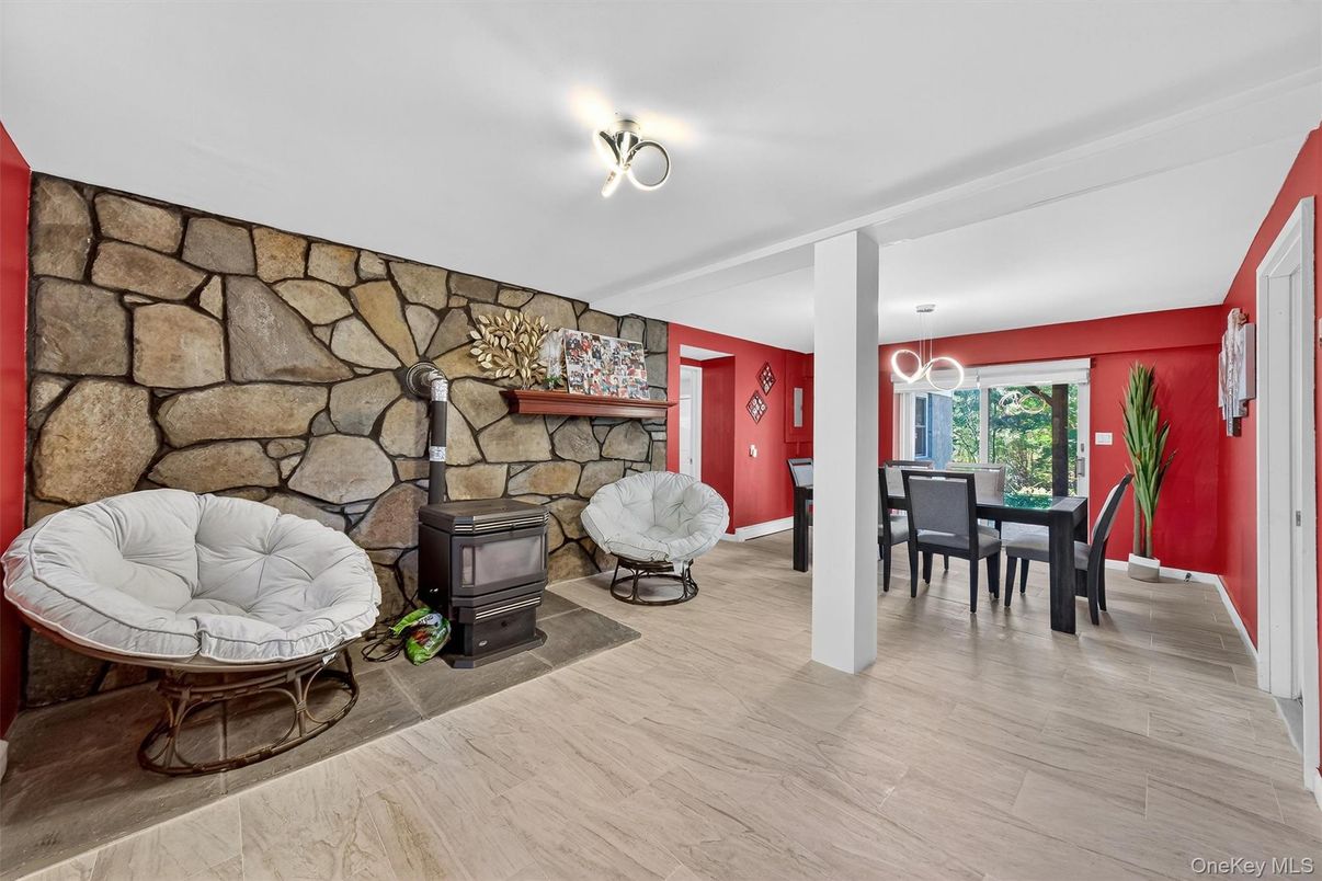 Dining room, Fireplace, Interior, Pendant Lights, Stone Walls, Wood Texture Flooring