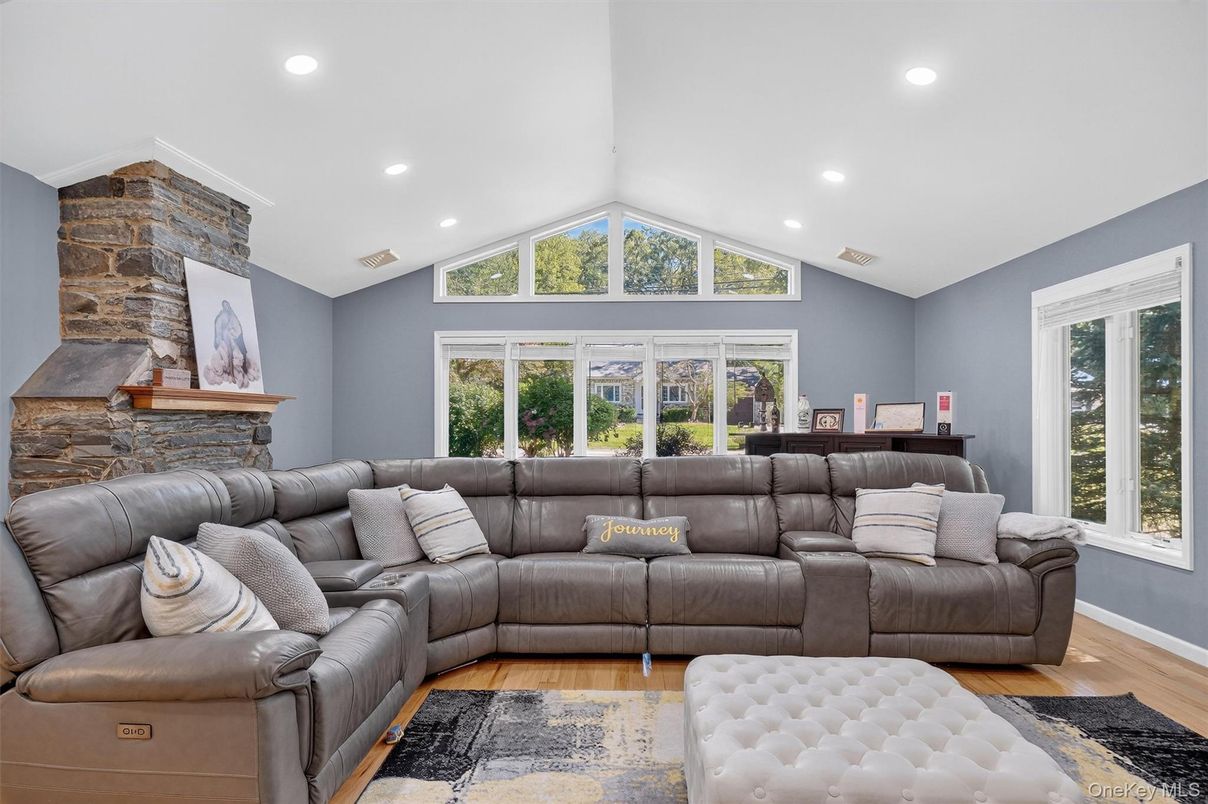 Fireplace, Interior, Living room, Recessed Lighting, Stone Walls, Wood Texture Flooring
