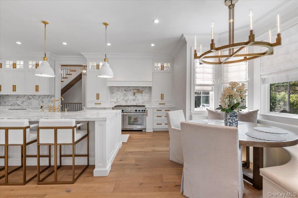 Dining room, Interior, Kitchen, Marble Walls, Pendant Lights, Recessed Lighting, Stainless Steel Appliances, Wood Texture Flooring