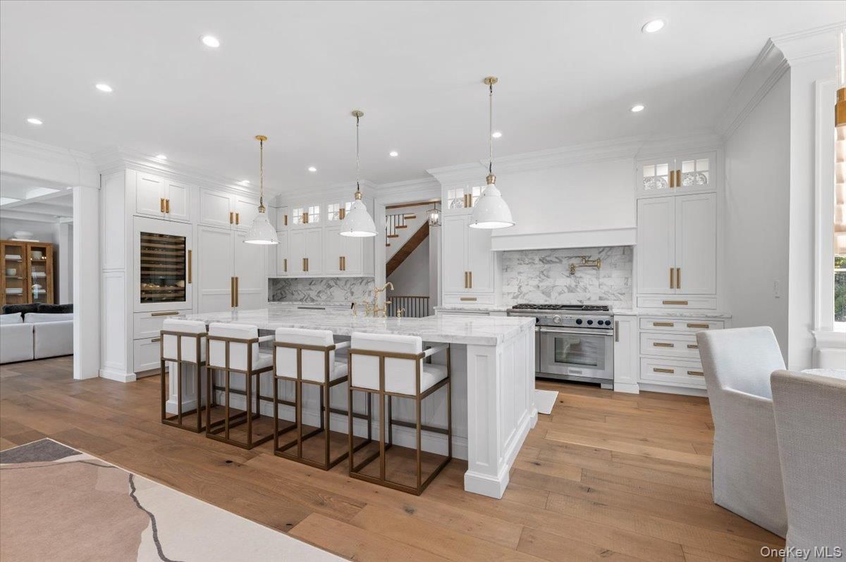Interior, Kitchen, Marble Walls, Pendant Lights, Recessed Lighting, Stainless Steel Appliances, Wood Texture Flooring