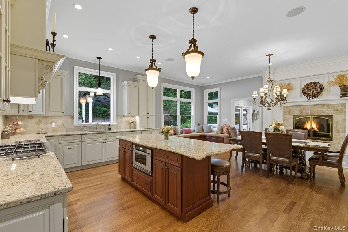 Chandelier, Dining room, Fireplace, Interior, Kitchen, Pendant Lights, Recessed Lighting, Wood Texture Flooring
