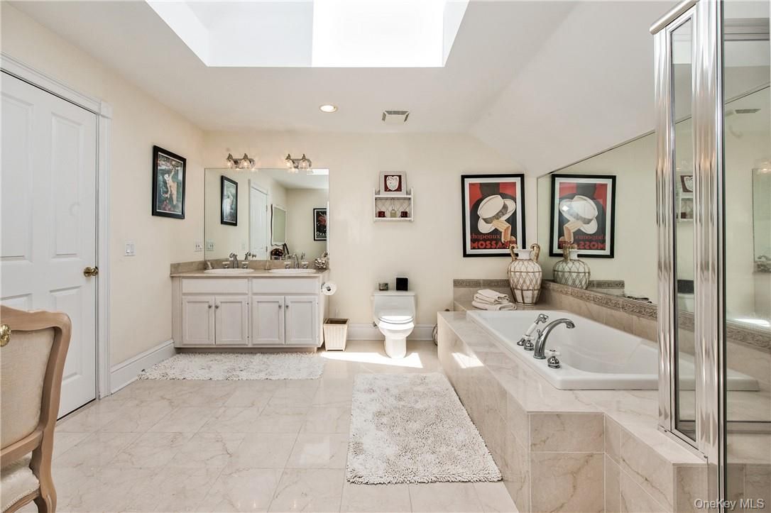 Bathroom, Dual Sink Vanities, Glass Shower, Interior, Marble, Recessed Lighting