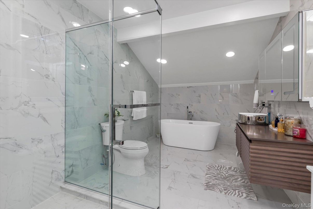 Bathroom, Free Standing Baths, Glass Shower, Interior, Marble, Marble Walls, Recessed Lighting