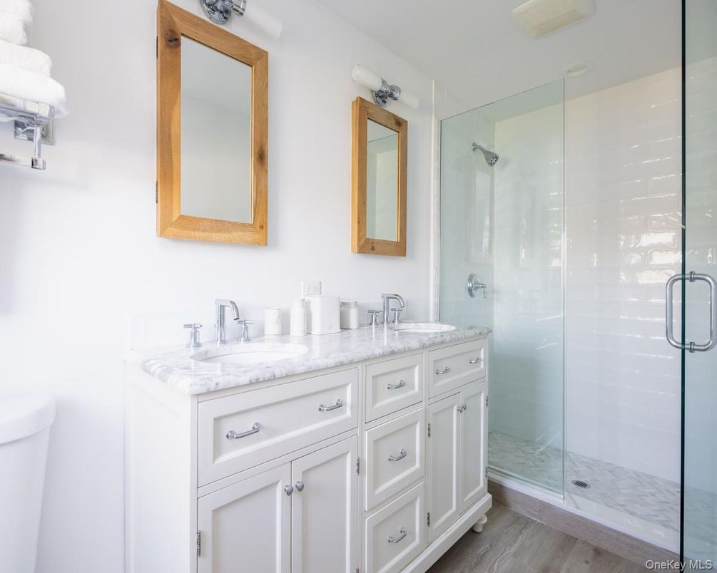 Bathroom, Dual Sink Vanities, Glass Shower, Interior, Wood Texture Flooring