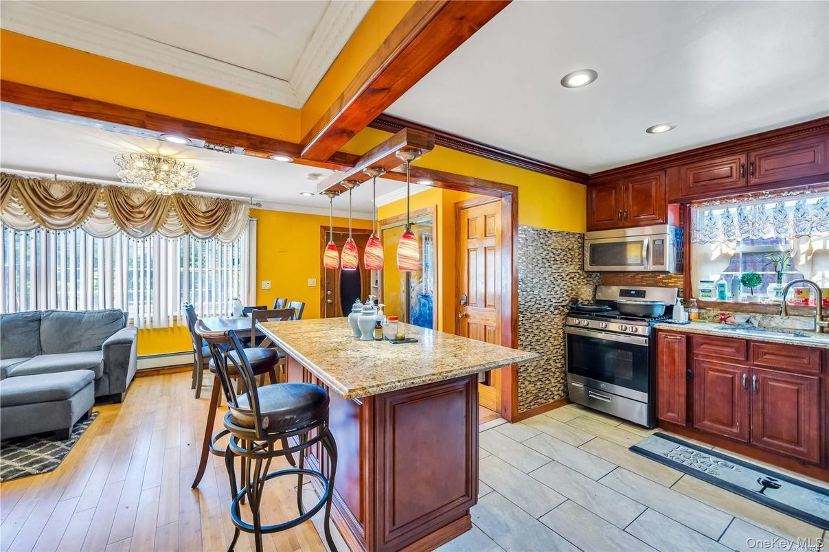 Chandelier, Dining room, Interior, Kitchen, Recessed Lighting, Stainless Steel Appliances, Wood Texture Flooring