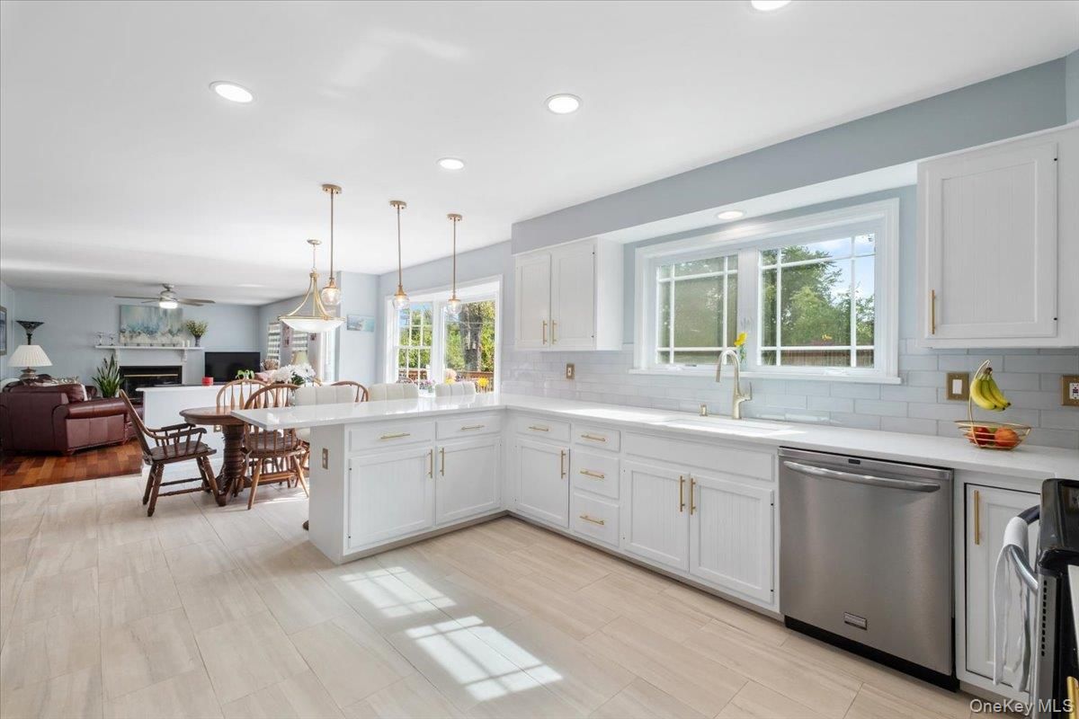 Dining room, Fireplace, Interior, Kitchen, Living room, Pendant Lights, Recessed Lighting, Stainless Steel Appliances, Wood Texture Flooring