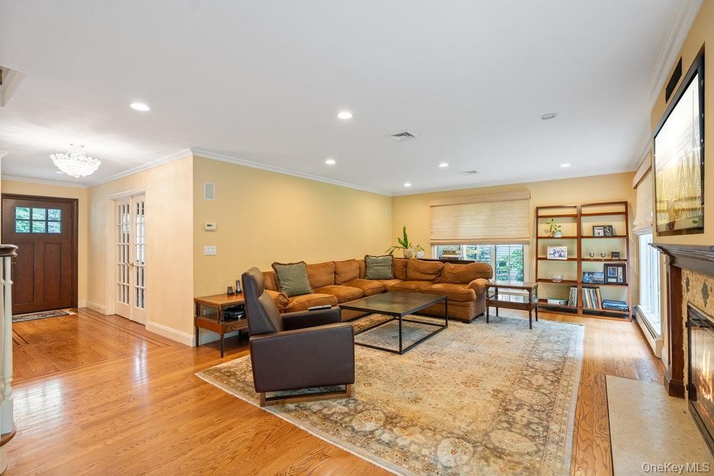 Chandelier, Fireplace, Interior, Living room, Recessed Lighting, Wood Texture Flooring
