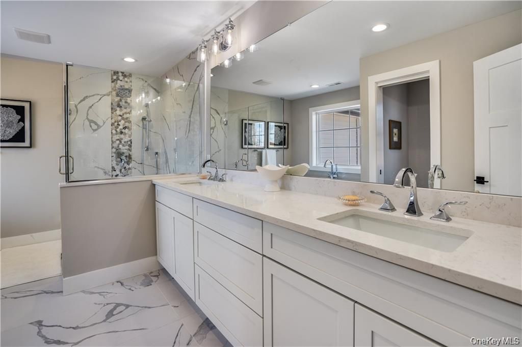 Bathroom, Dual Sink Vanities, Glass Shower, Interior, Marble, Marble Walls, Recessed Lighting