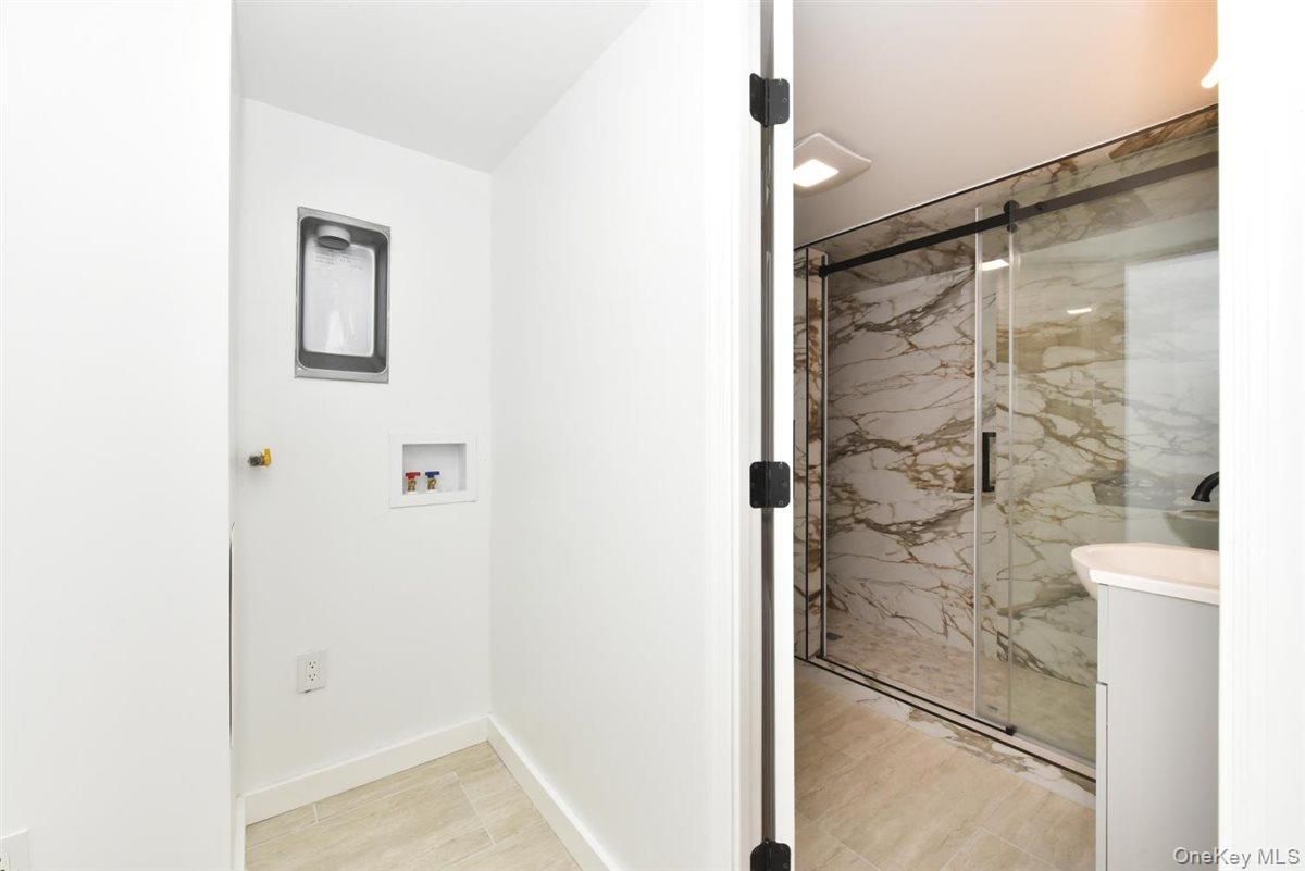 Bathroom, Glass Shower, Interior, Marble Walls, Wood Texture Flooring