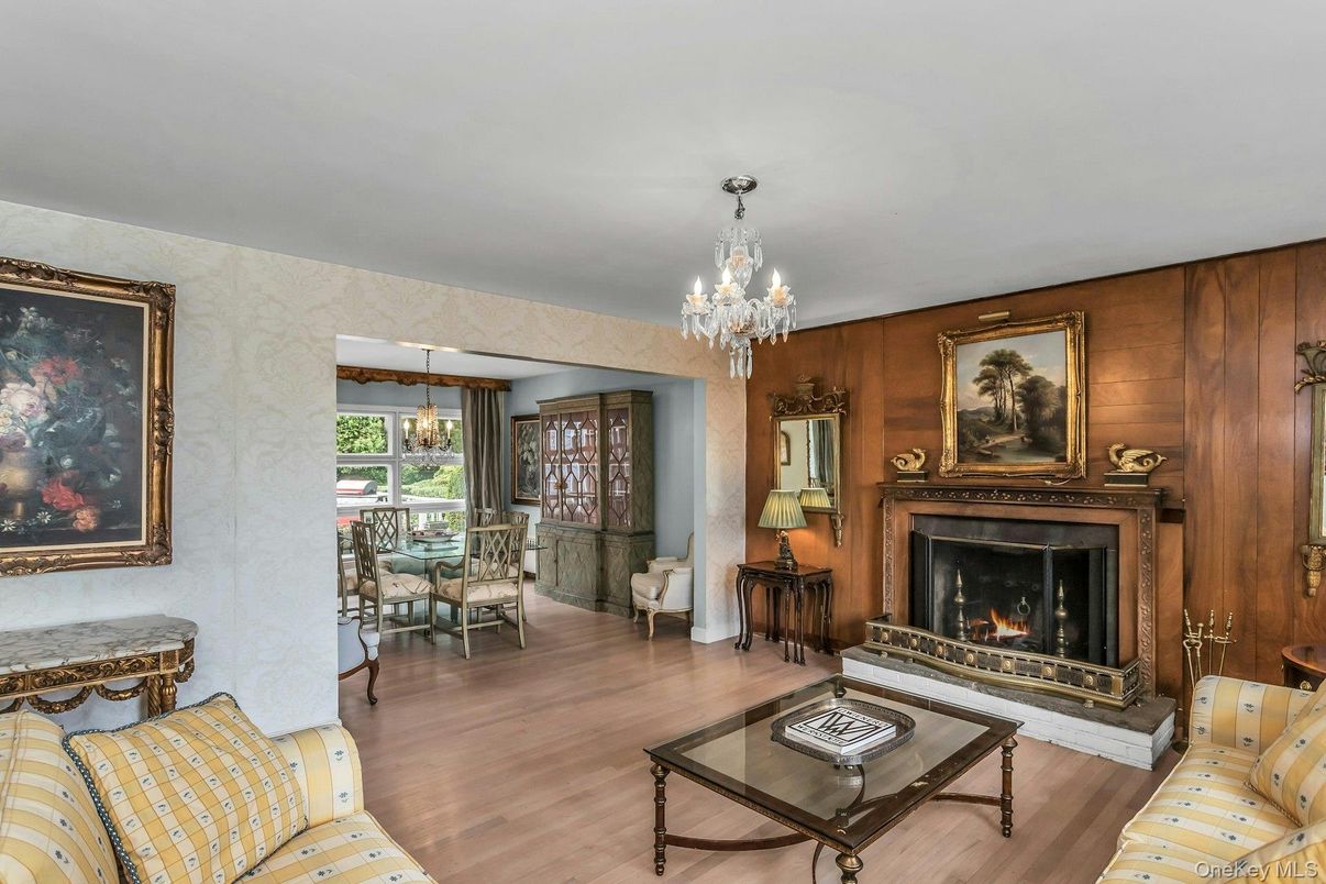 Chandelier, Dining room, Fireplace, Interior, Living room, Pendant Lights, Wood Texture Flooring, Wooden Walls