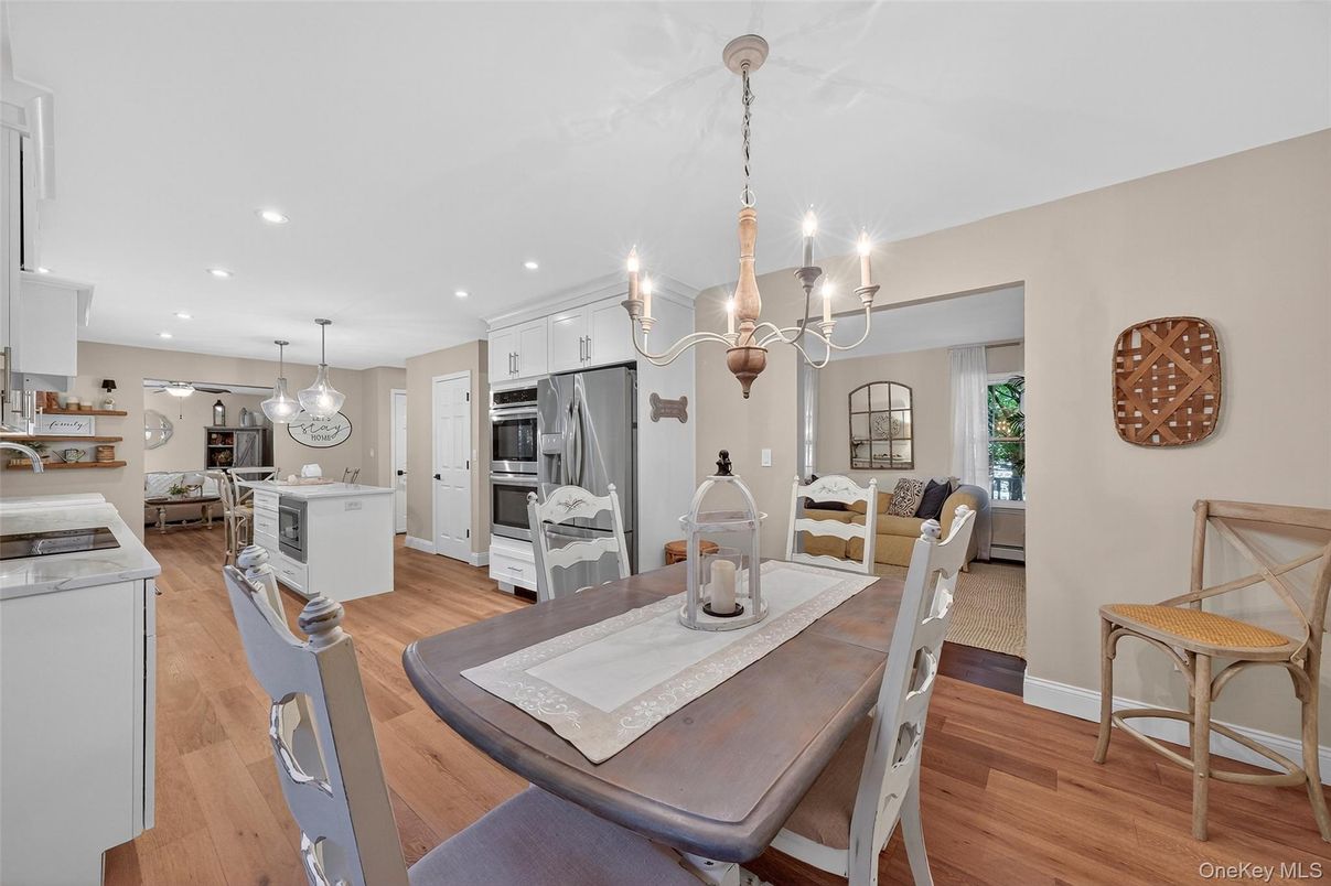 Chandelier, Dining room, Interior, Kitchen, Pendant Lights, Recessed Lighting, Stainless Steel Appliances, Wood Texture Flooring