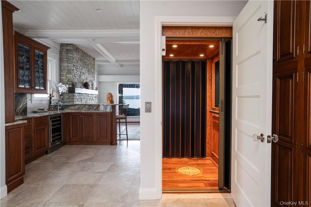 Elevator, Interior, Recessed Lighting, Stone Walls, Wood Texture Flooring