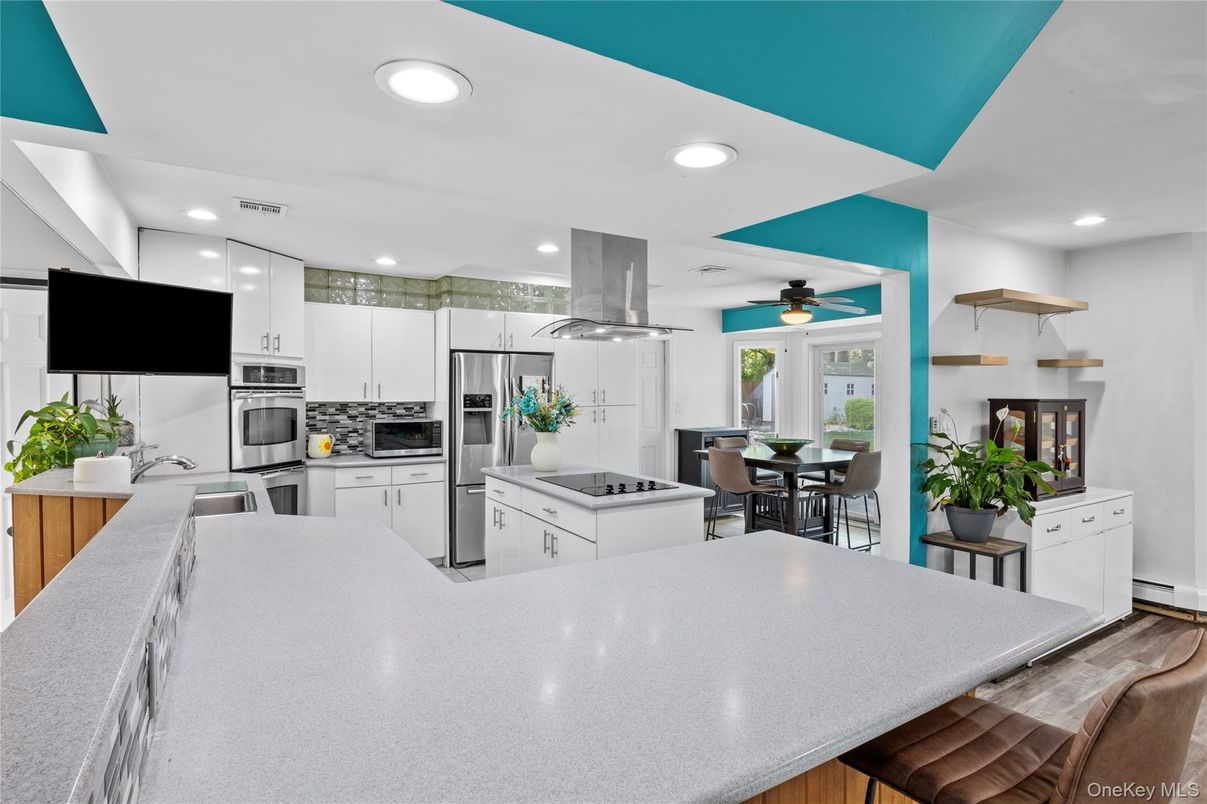 Dining room, Interior, Kitchen, Recessed Lighting, Stainless Steel Appliances, Wood Texture Flooring