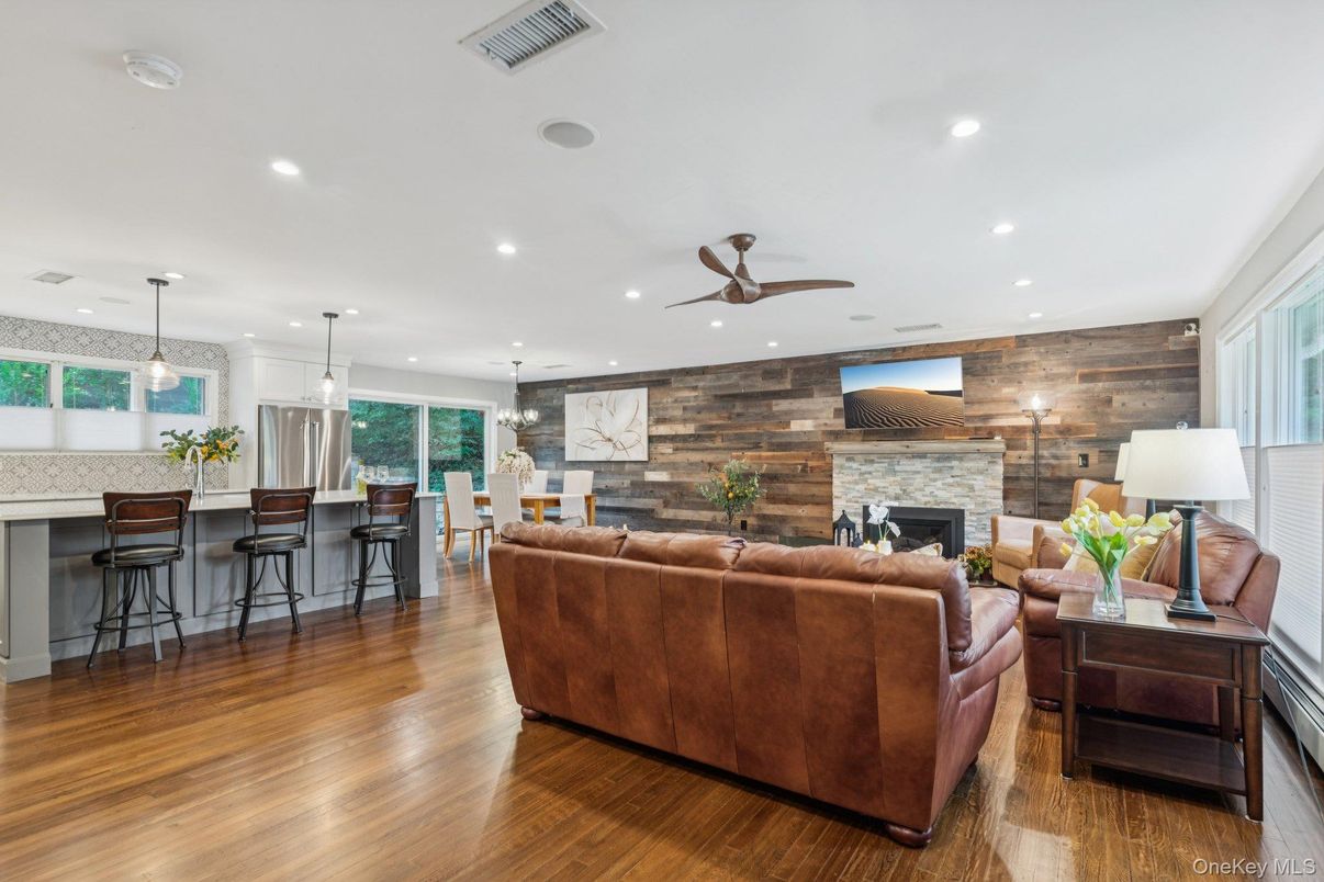 Dining room, Fireplace, Interior, Living room, Pendant Lights, Recessed Lighting, Stone Walls, Wood Texture Flooring, Wooden Walls