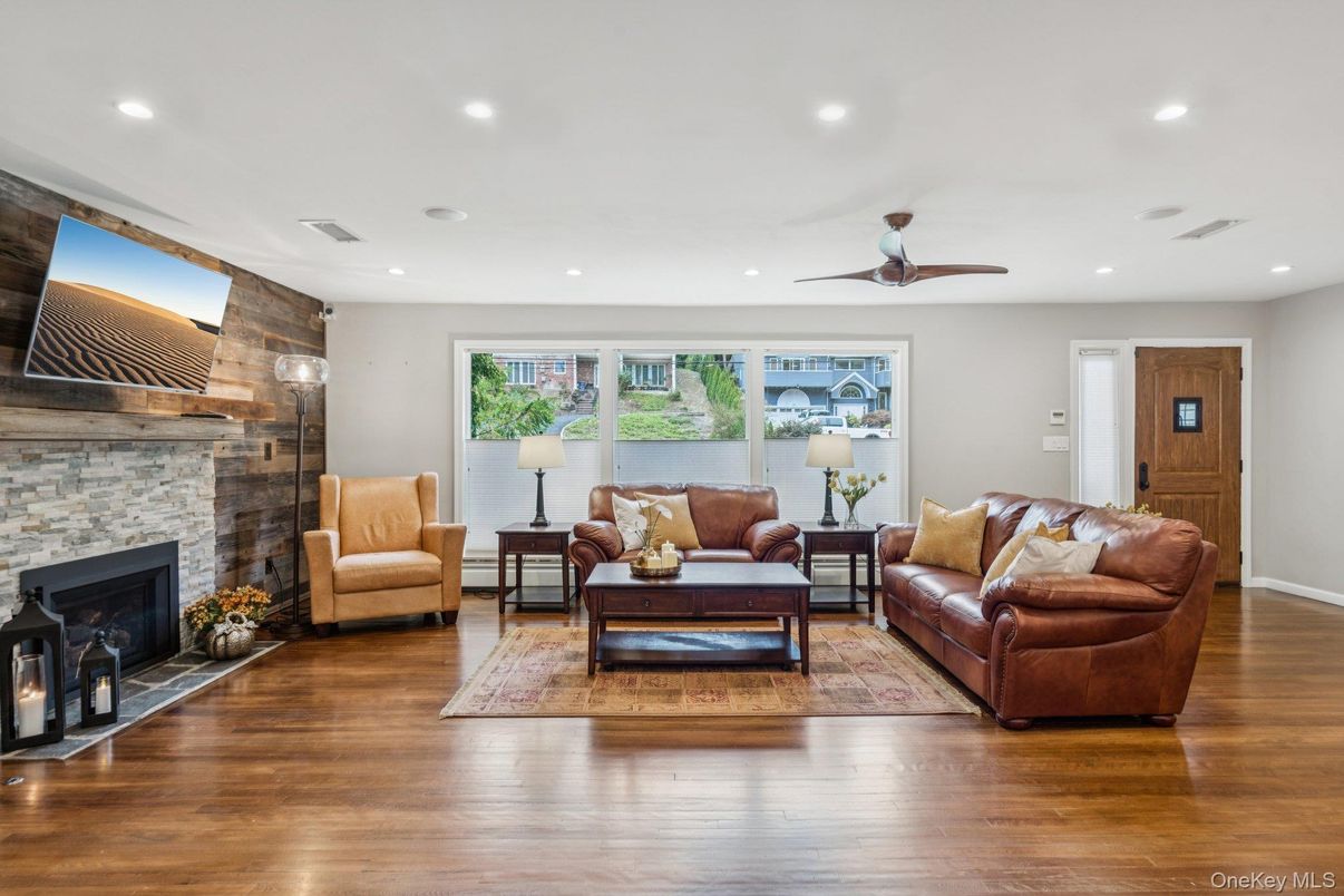 Fireplace, Interior, Living room, Recessed Lighting, Stone Walls, Wood Texture Flooring