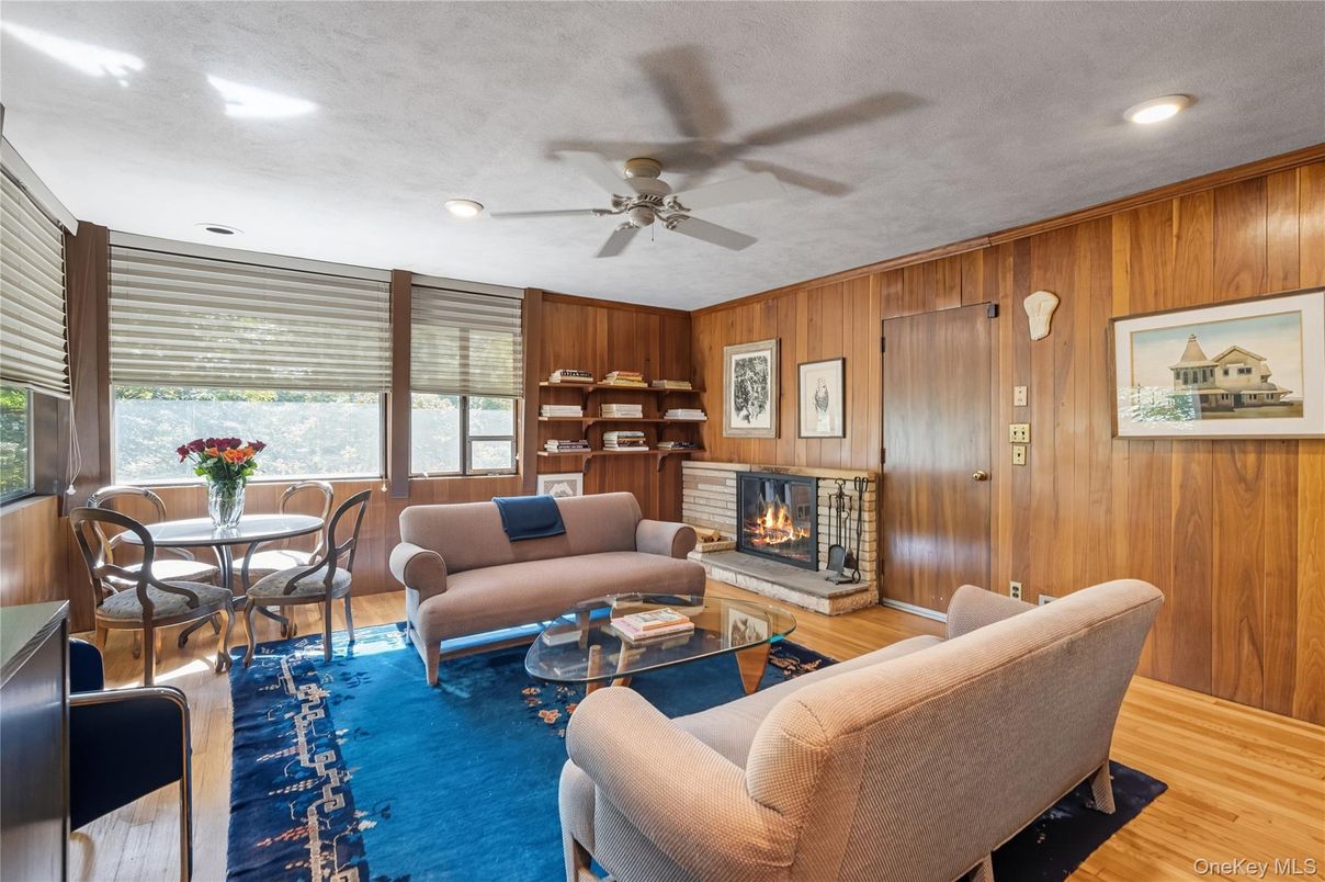 Dining room, Fireplace, Interior, Living room, Recessed Lighting, Wood Texture Flooring, Wooden Walls