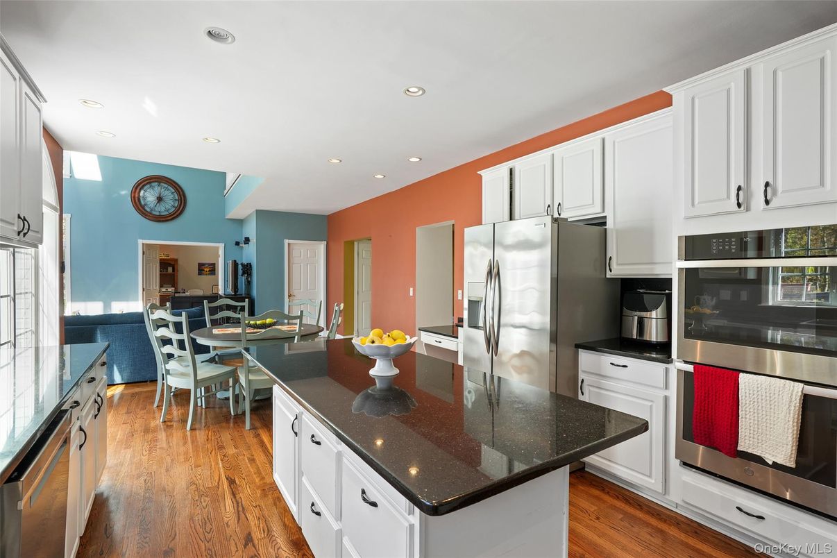 Dining room, Interior, Kitchen, Recessed Lighting, Stainless Steel Appliances, Water, Wood Texture Flooring