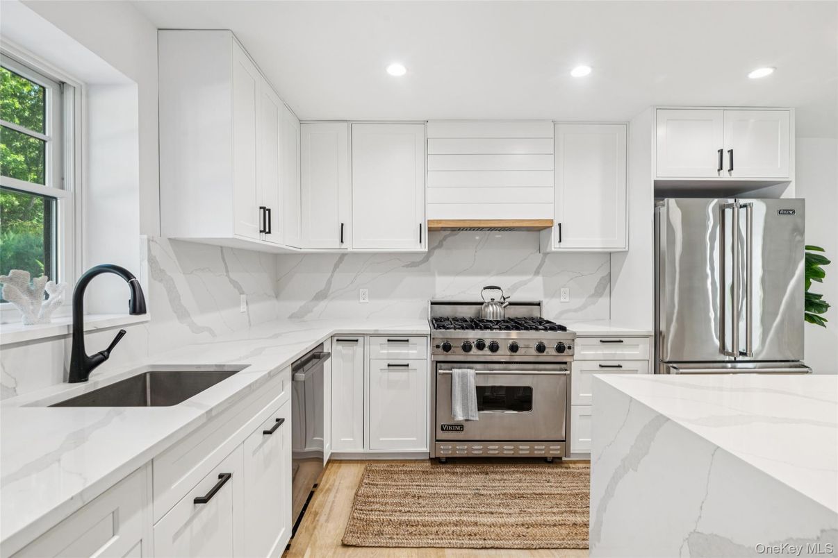 Interior, Kitchen, Marble Walls, Recessed Lighting, Stainless Steel Appliances, Wood Texture Flooring