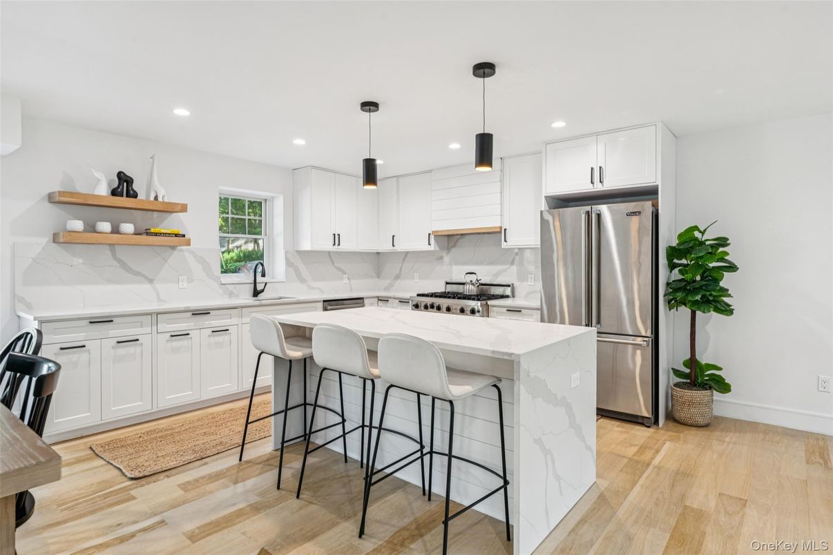 Interior, Kitchen, Marble Walls, Pendant Lights, Recessed Lighting, Stainless Steel Appliances, Wood Texture Flooring