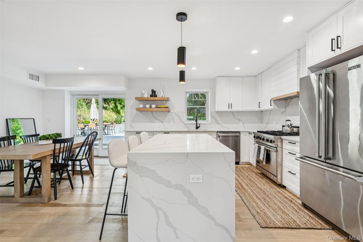 Dining room, Interior, Kitchen, Pendant Lights, Recessed Lighting, Stainless Steel Appliances, Wood Texture Flooring