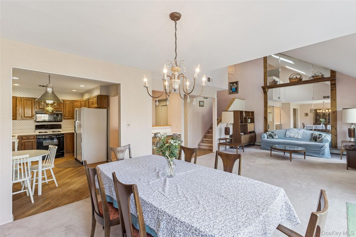 Chandelier, Dining room, Interior, Kitchen, Living room, Recessed Lighting, Stainless Steel Appliances, Wood Texture Flooring