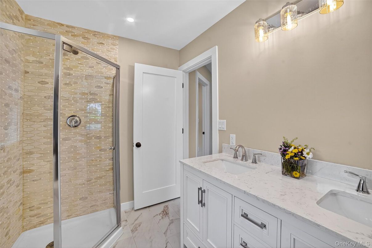 Bathroom, Dual Sink Vanities, Glass Shower, Interior, Marble, Recessed Lighting