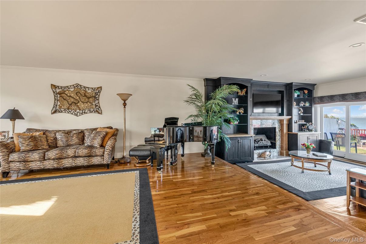 Fireplace, Interior, Living room, Piano, Recessed Lighting, Wood Texture Flooring