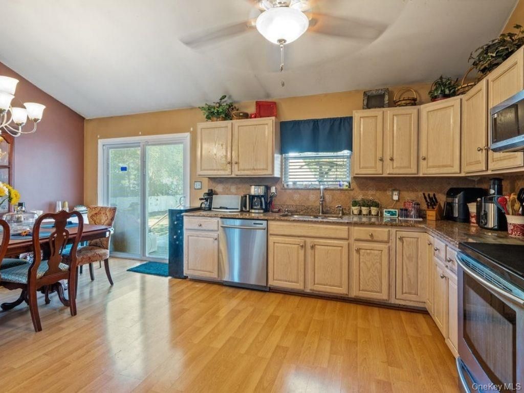Chandelier, Dining room, Interior, Kitchen, Stainless Steel Appliances, Wood Texture Flooring