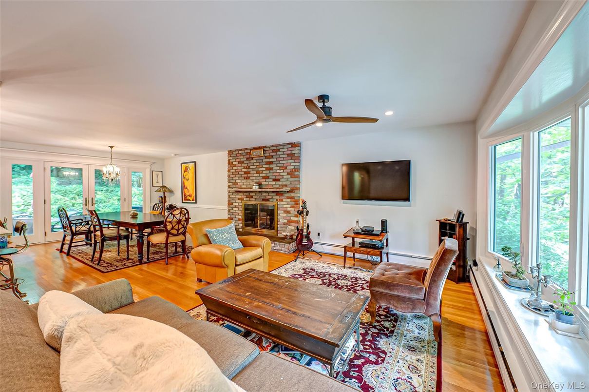 Chandelier, Dining room, Fireplace, Interior, Living room, Recessed Lighting, Stone Walls, Wood Texture Flooring