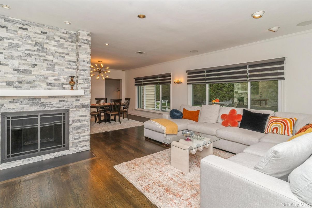 Dining room, Fireplace, Interior, Living room, Pendant Lights, Recessed Lighting, Stone Walls, Wood Texture Flooring