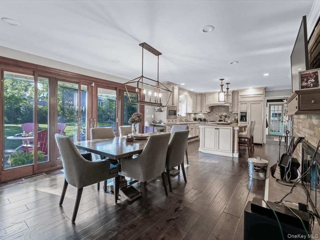 Dining room, Interior, Kitchen, Pendant Lights, Recessed Lighting, Stainless Steel Appliances, Wood Texture Flooring