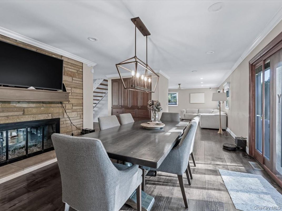 Dining room, Fireplace, Interior, Living room, Pendant Lights, Recessed Lighting, Wood Texture Flooring