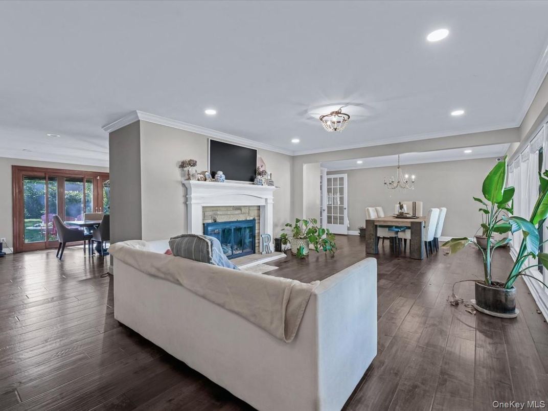 Chandelier, Dining room, Fireplace, Interior, Living room, Recessed Lighting, Wood Texture Flooring