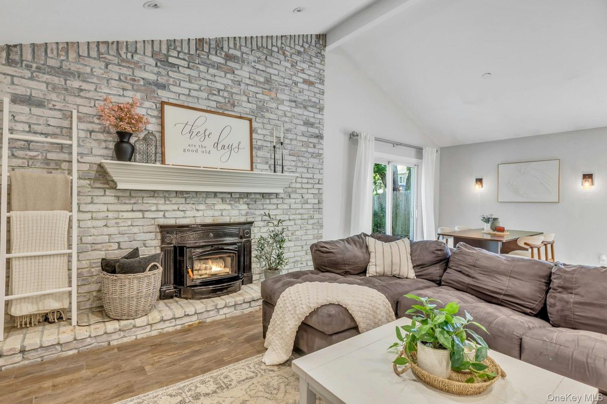 Fireplace, Interior, Living room, Recessed Lighting, Stone Walls, Wood Texture Flooring