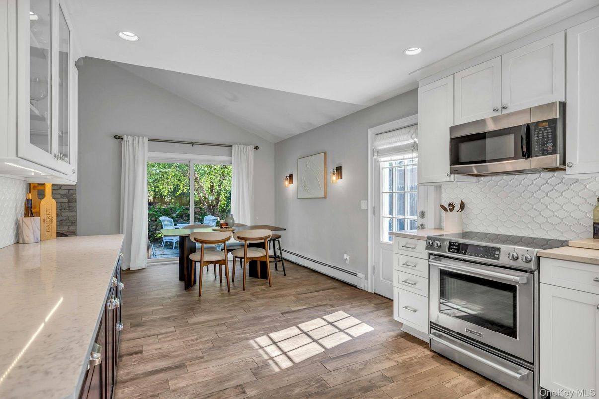 Dining room, Interior, Kitchen, Recessed Lighting, Stainless Steel Appliances, Wood Texture Flooring