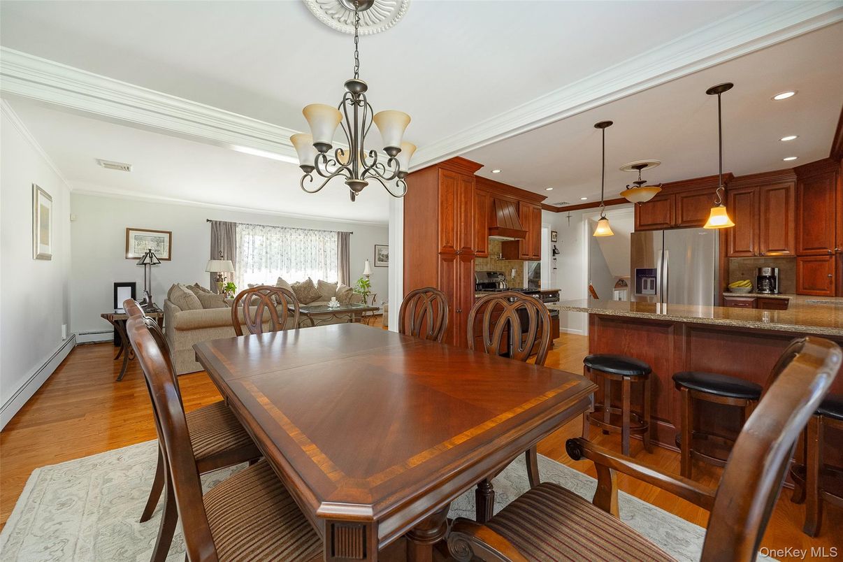 Chandelier, Dining room, Interior, Kitchen, Pendant Lights, Recessed Lighting, Stainless Steel Appliances, Wood Texture Flooring