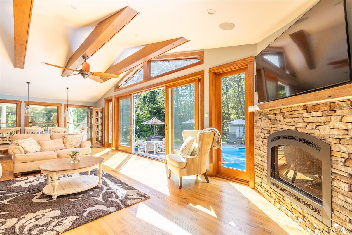 Fireplace, Interior, Living room, Recessed Lighting, Stone Walls, Wooden Beams, Wood Texture Flooring