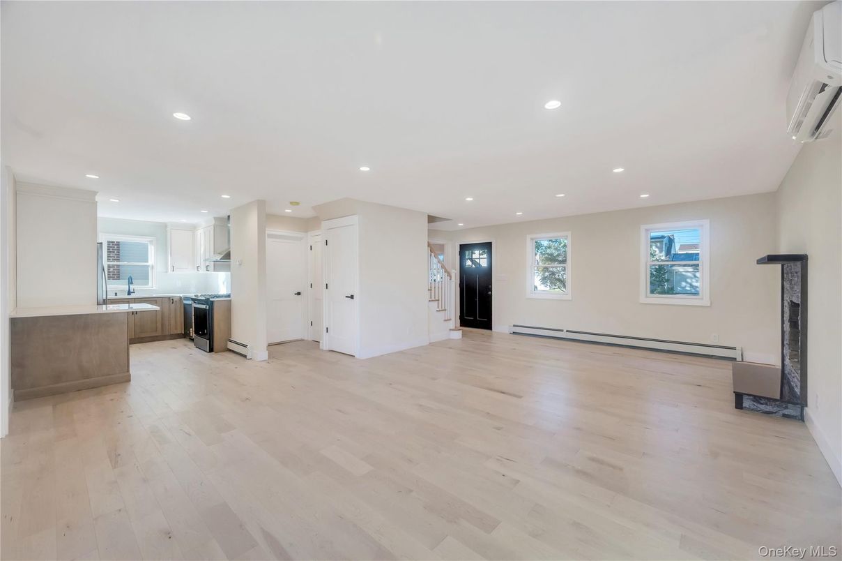 Empty room, Fireplace, Interior, Kitchen, Recessed Lighting, Wood Texture Flooring
